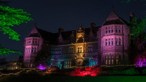 the house at Knightshayes illuminated by Christmas lights
